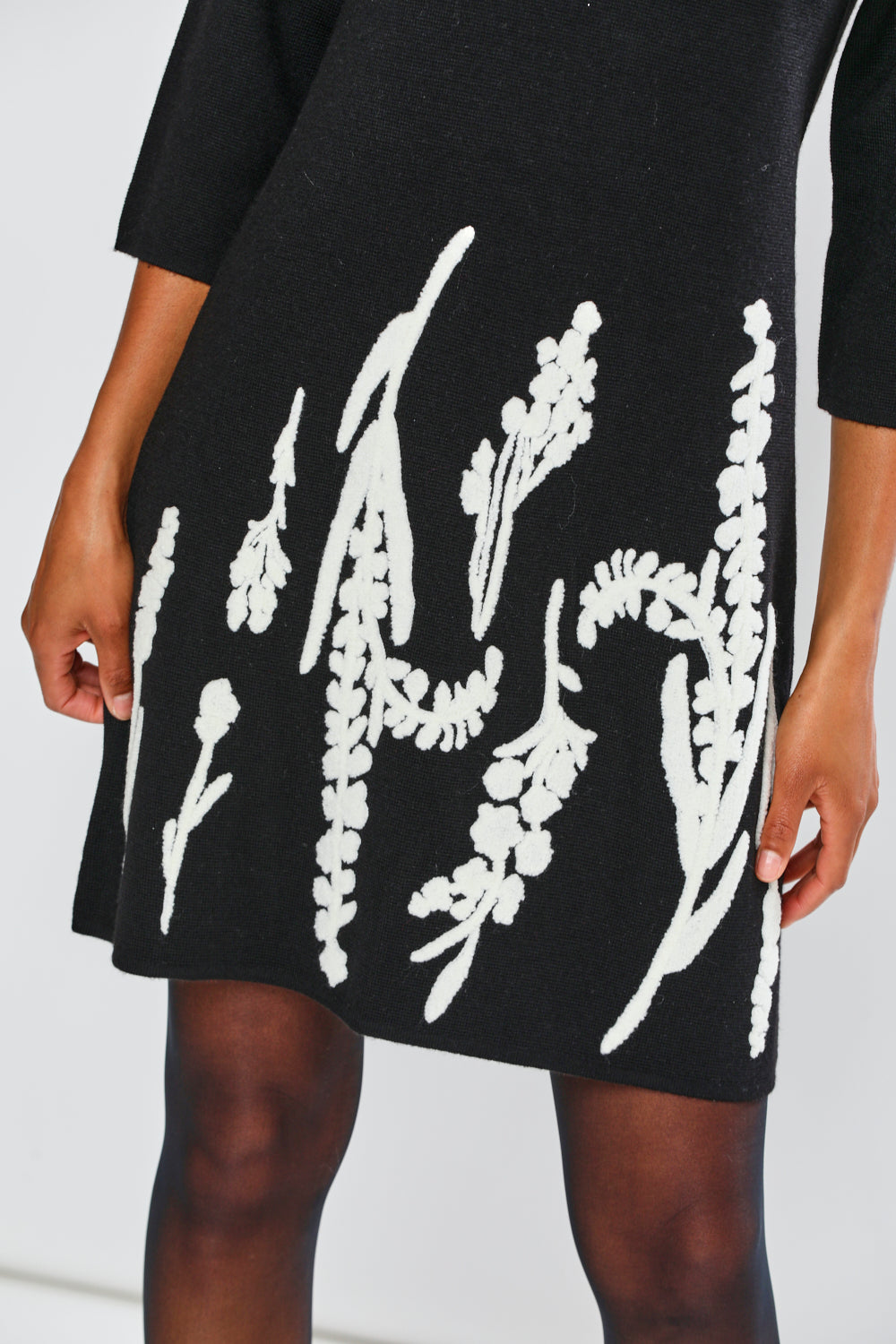 Woman in black printed dress