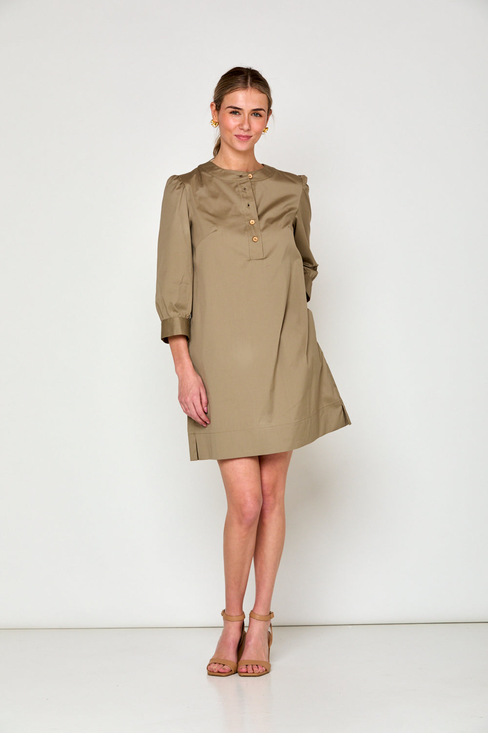 Woman in taupe dress