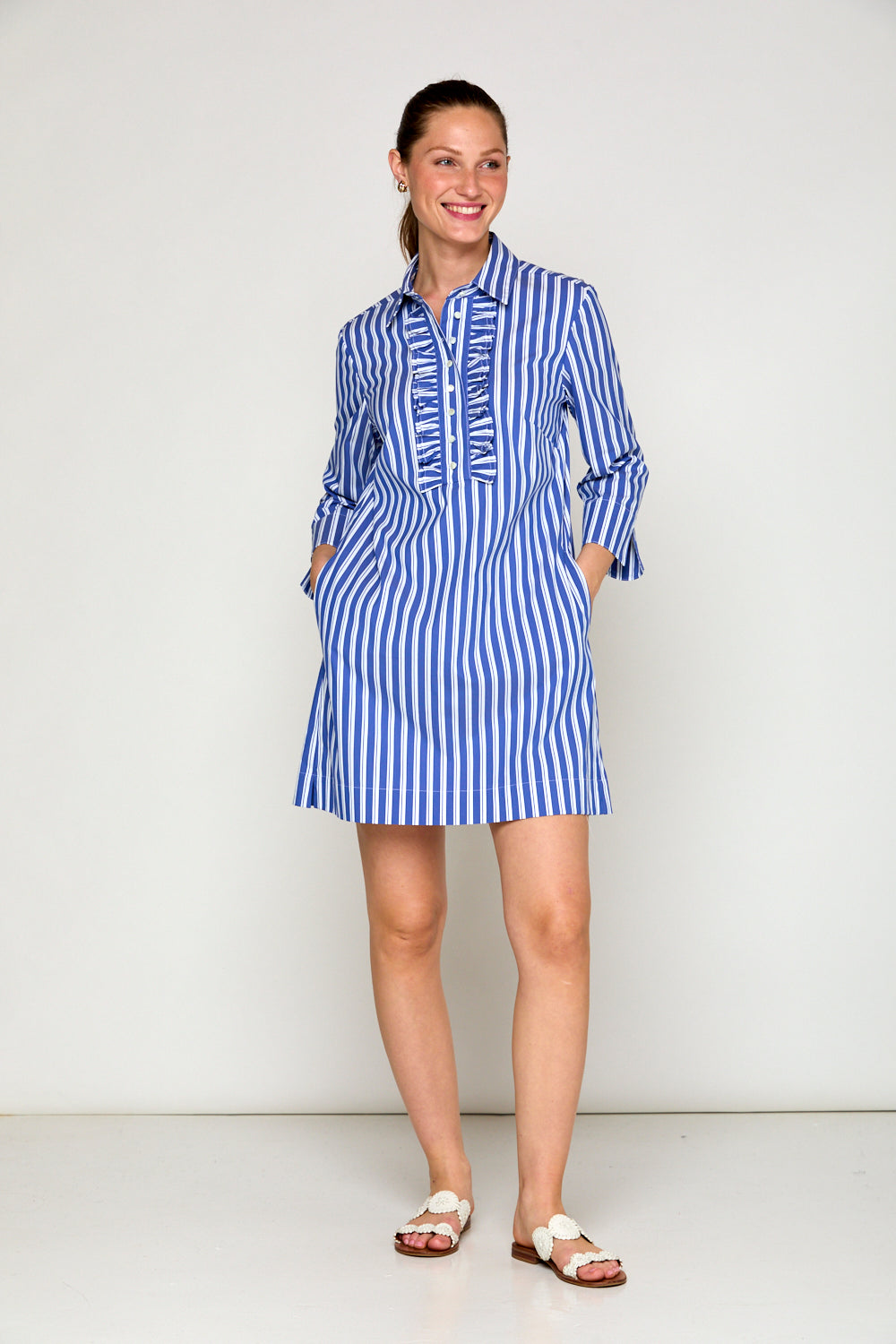 Woman in blue and white stripe dress