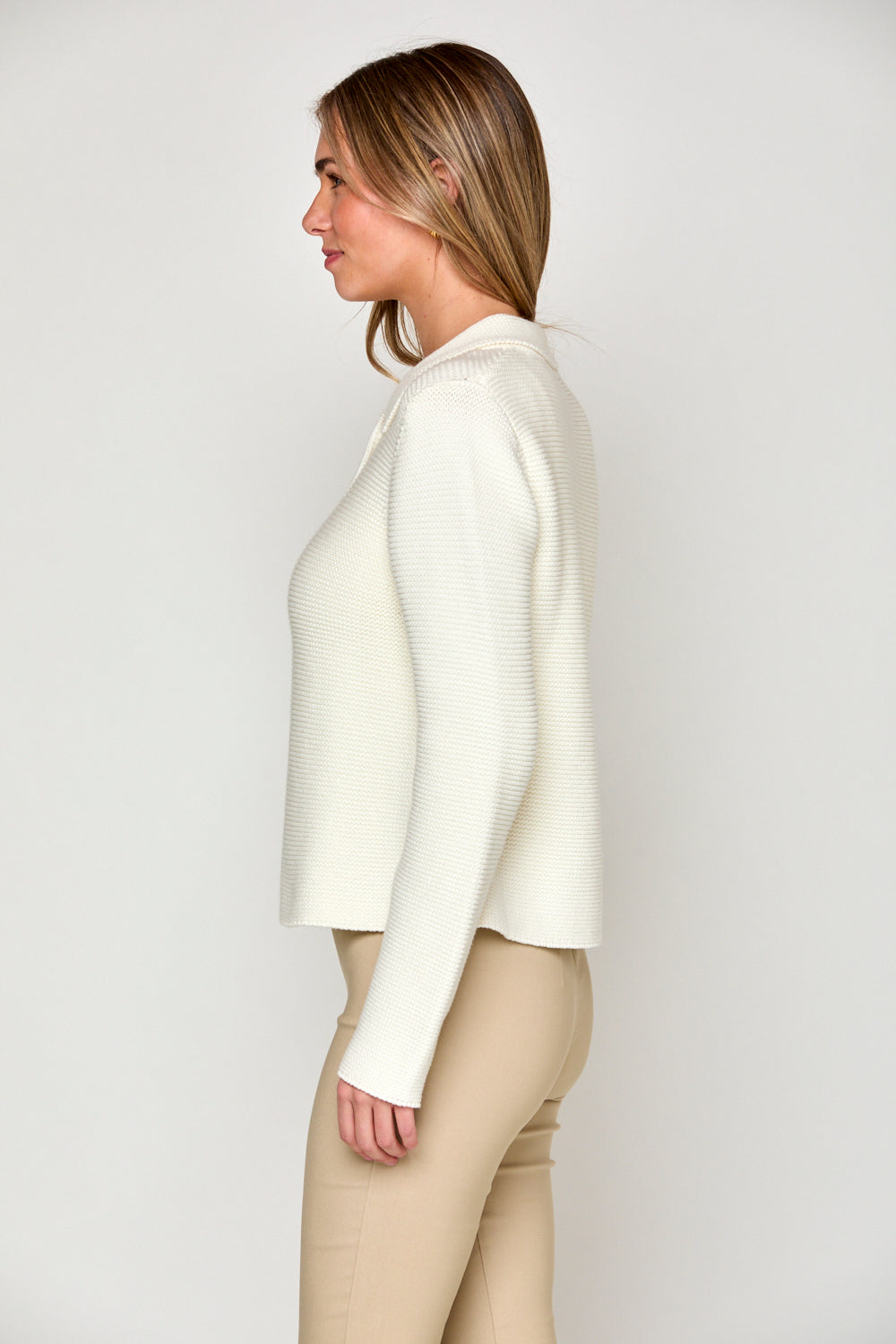 Woman in off white sweater