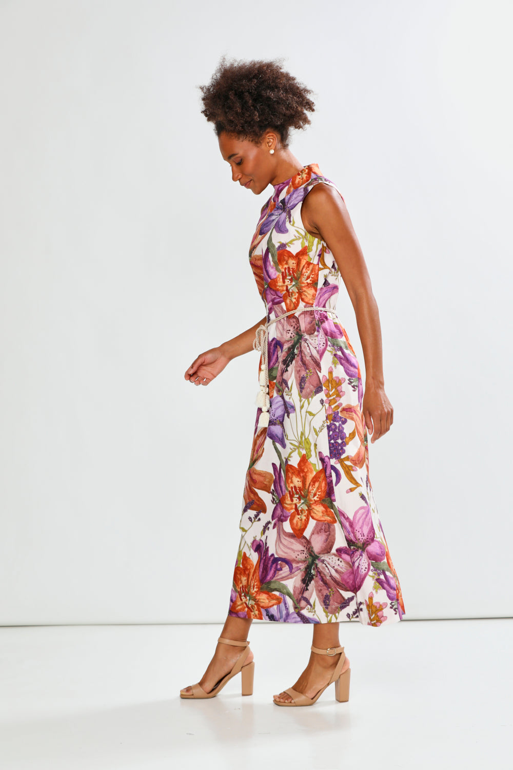 Woman in floral sleeveless dress