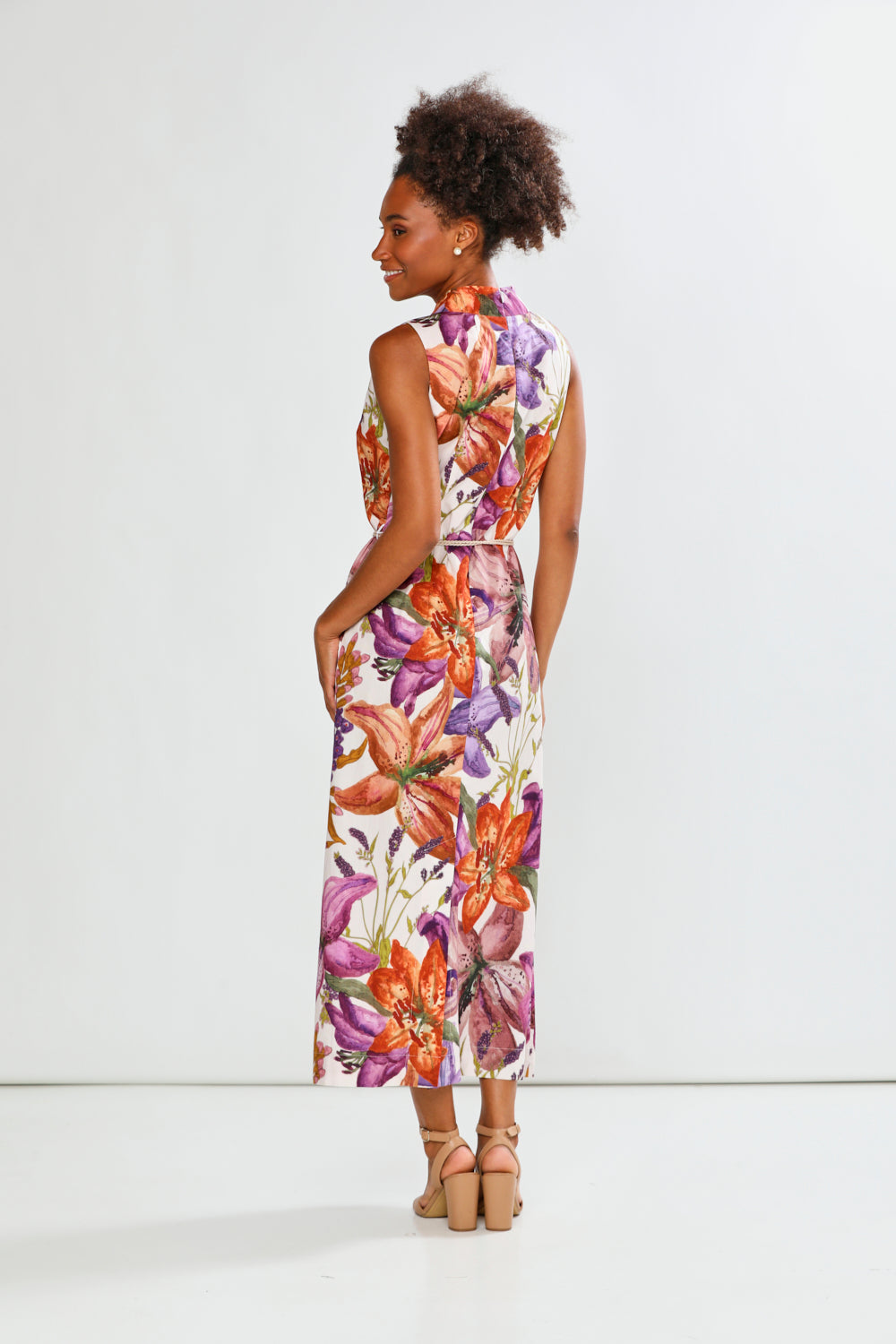 Woman in floral sleeveless dress