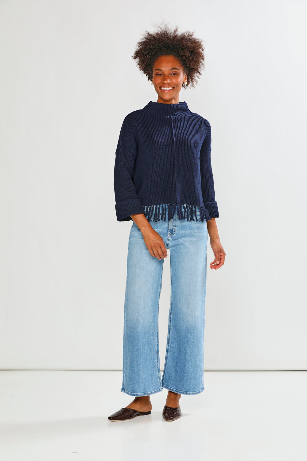 Woman in navy fringe edge sweater
