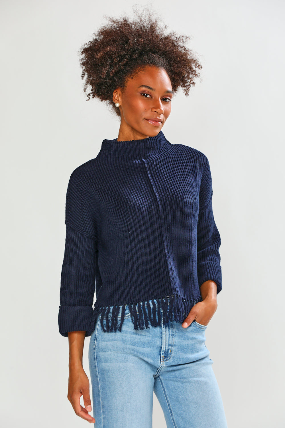Woman in navy fringe edge sweater