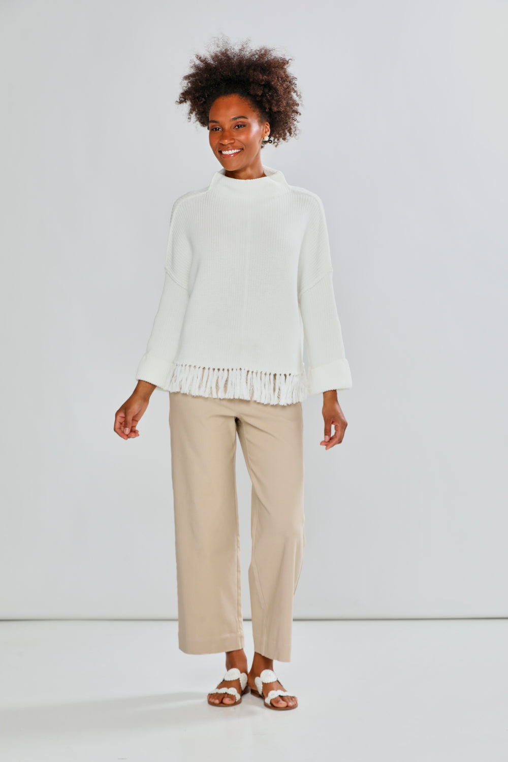 Woman in ivory fringe sweater