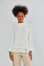 Woman in ivory fringe sweater