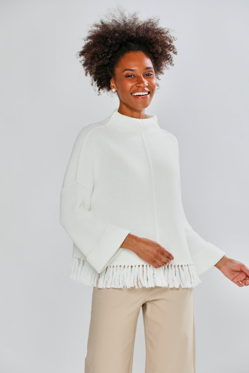 Woman in ivory fringe sweater