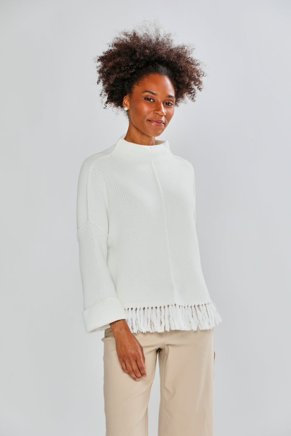 Woman in ivory fringe sweater