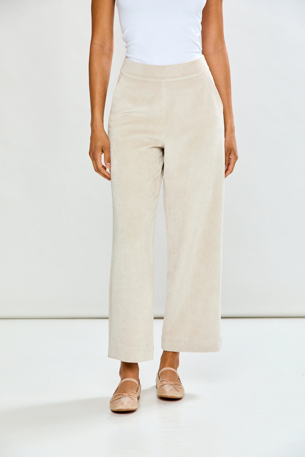 Woman in oyster corduroy pant