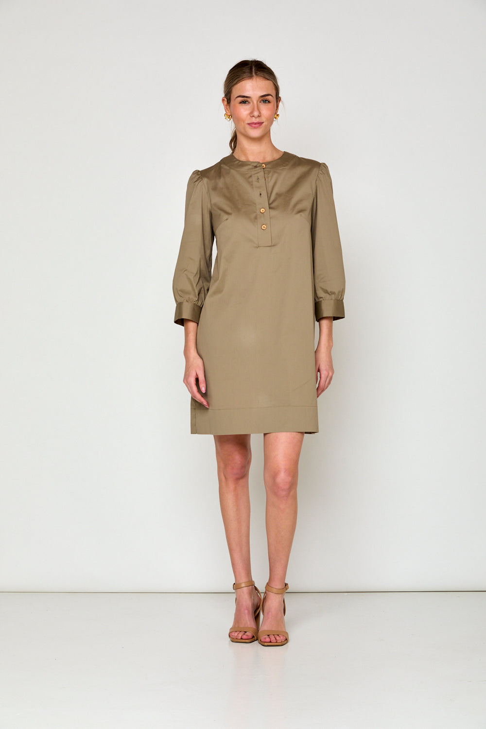 Woman in taupe dress