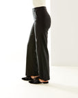 Woman in long black pants