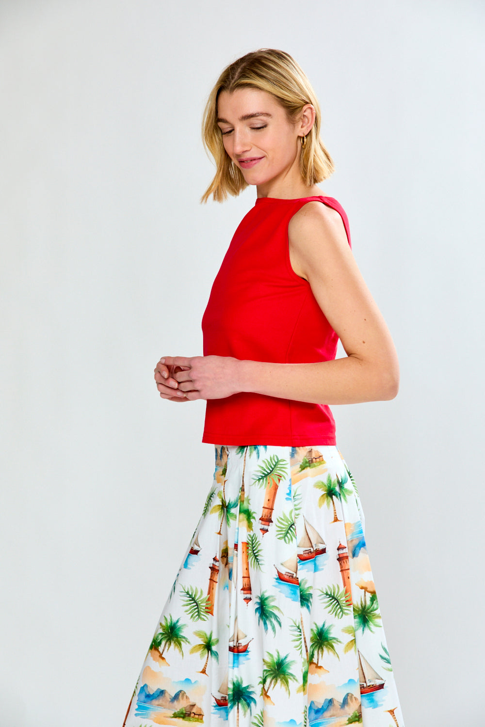 Woman in solid top and printed skirt