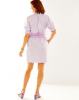 Woman in lilac striped dress