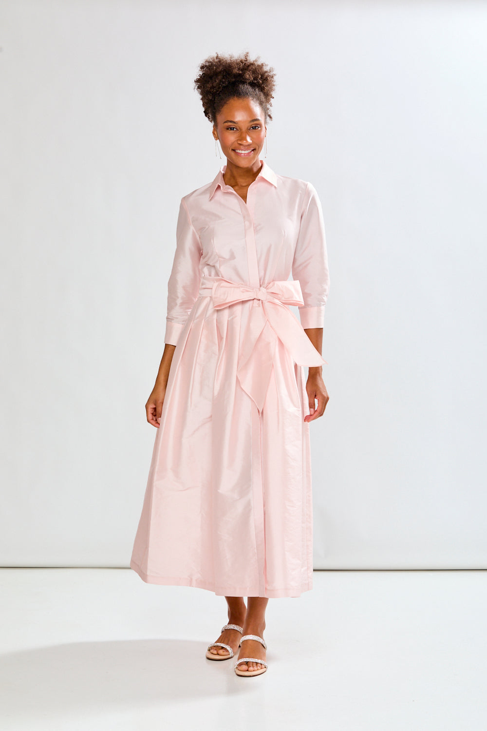 Woman in blush pink long taffeta dress