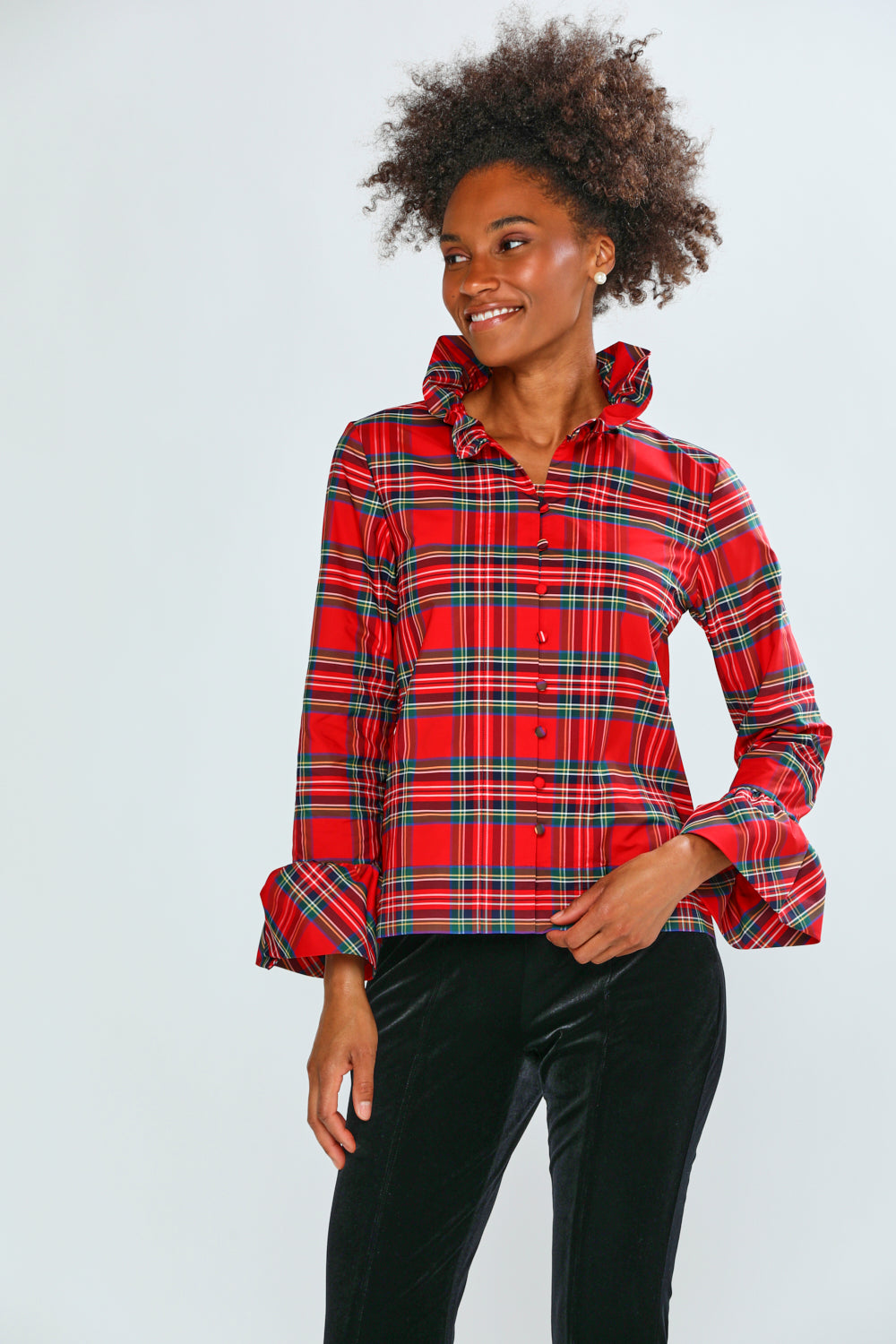 Person wearing a red plaid shirt on a white background