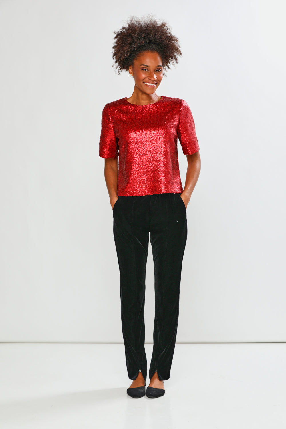 Woman in red blouse with black pants 