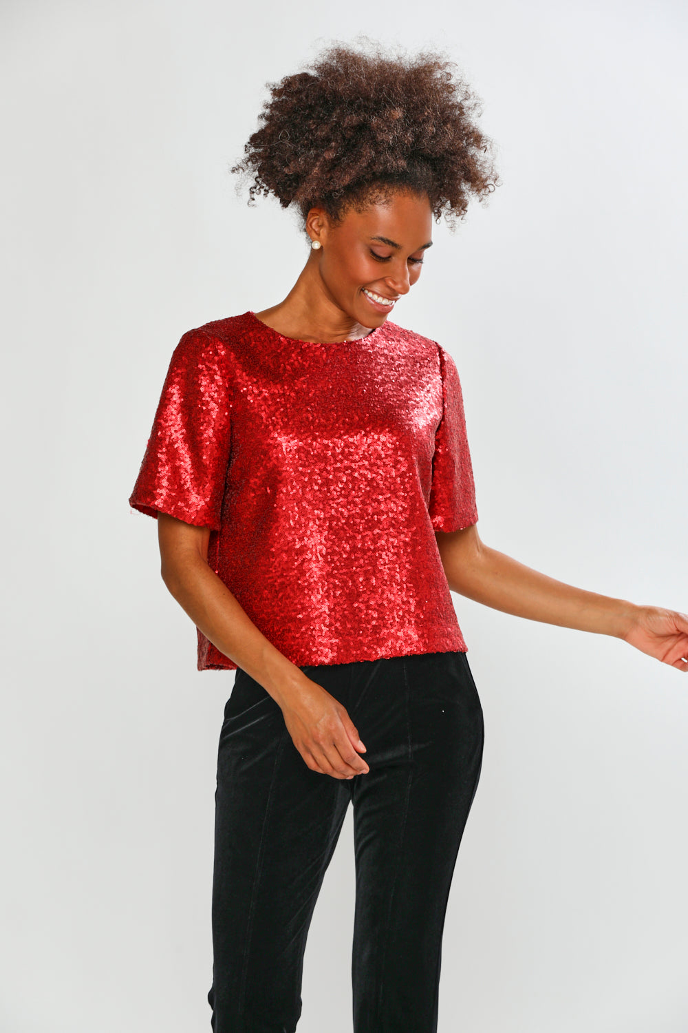 Woman in red blouse with black pants 