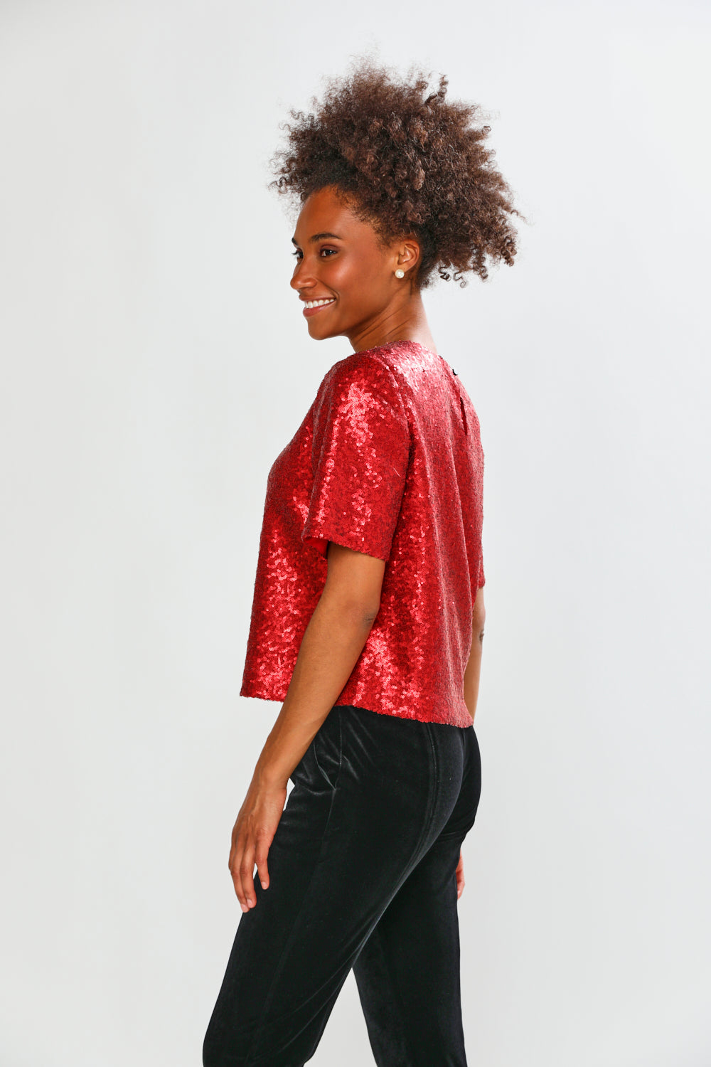Woman in red blouse with black pants 