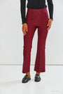 Maroon pants worn by a person on a white background