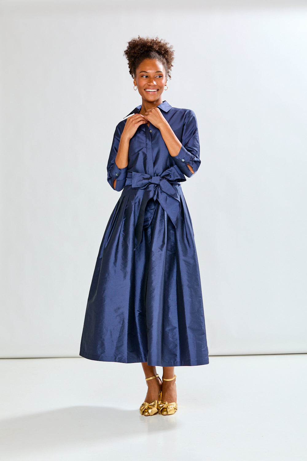 Woman in navy long taffeta dress