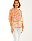 Woman in peasant sleeve blouse