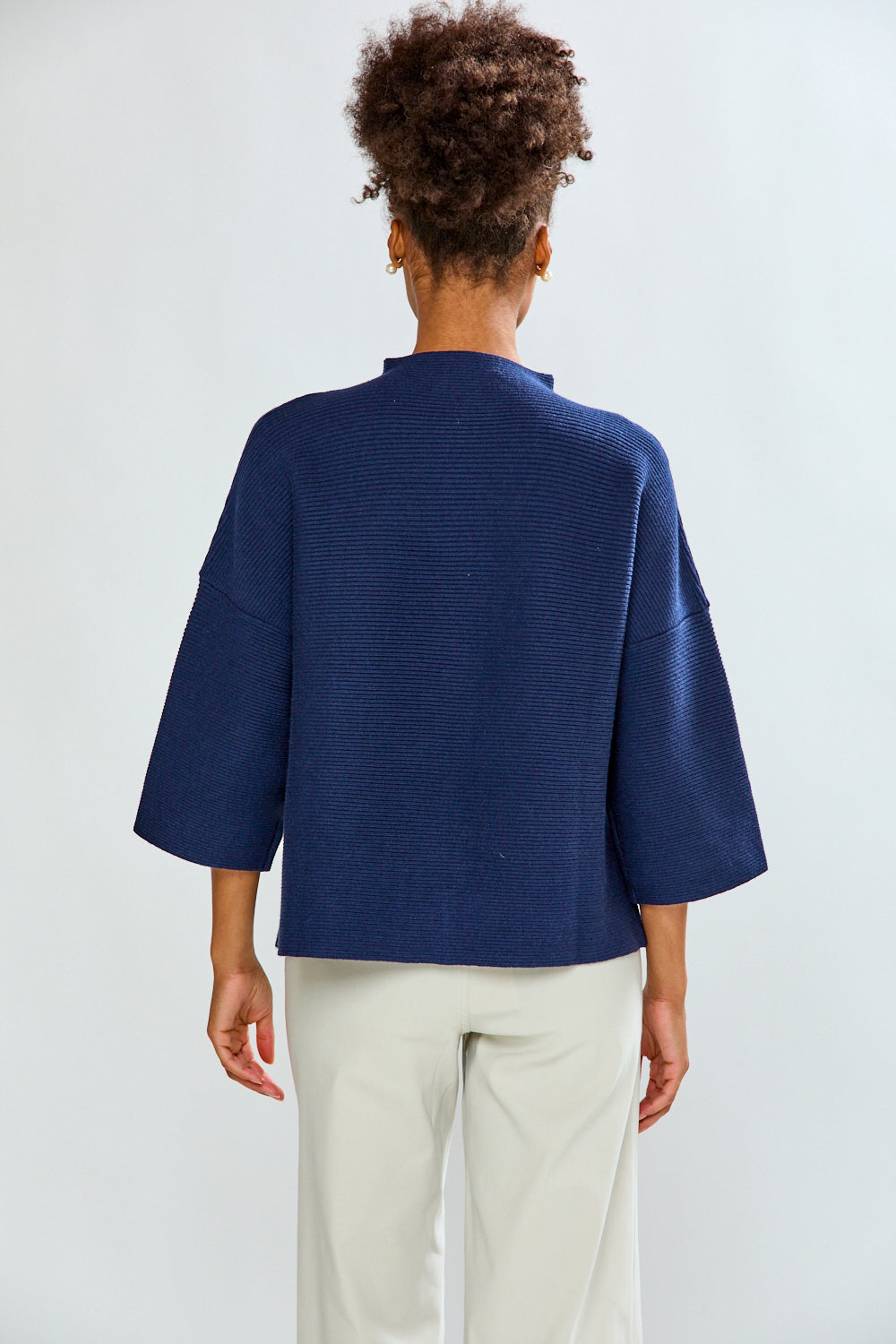 Girl is blue sweater