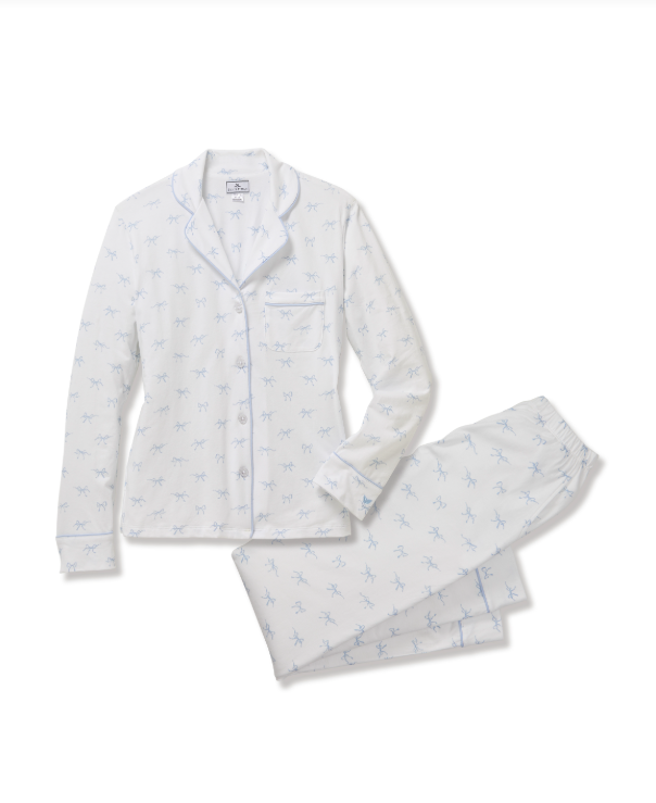 White pajama set with small blue patterns on a white background
