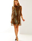 Woman in leopard print dress