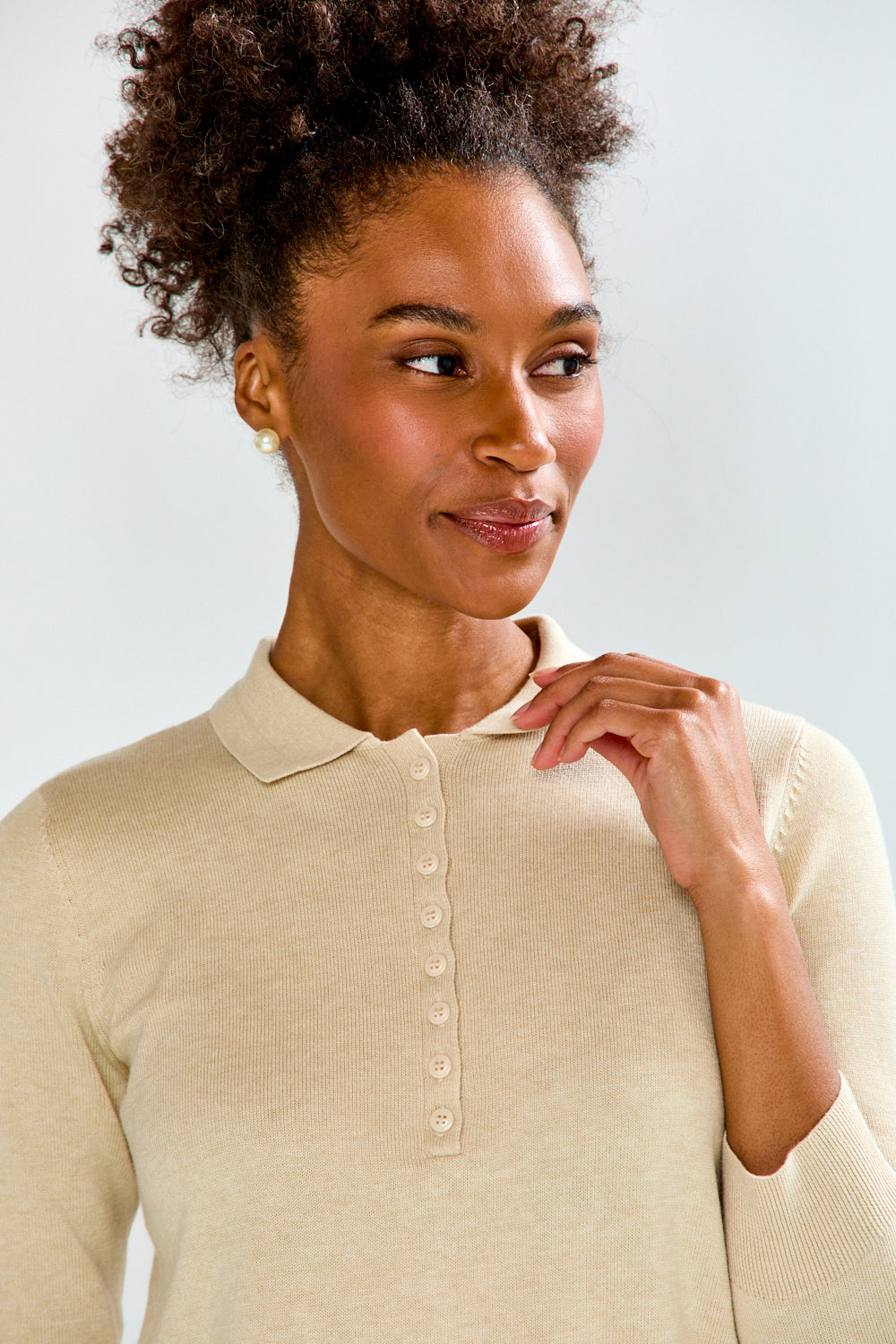 woman in sand sweater