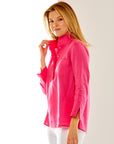 Woman in pink linen tunic