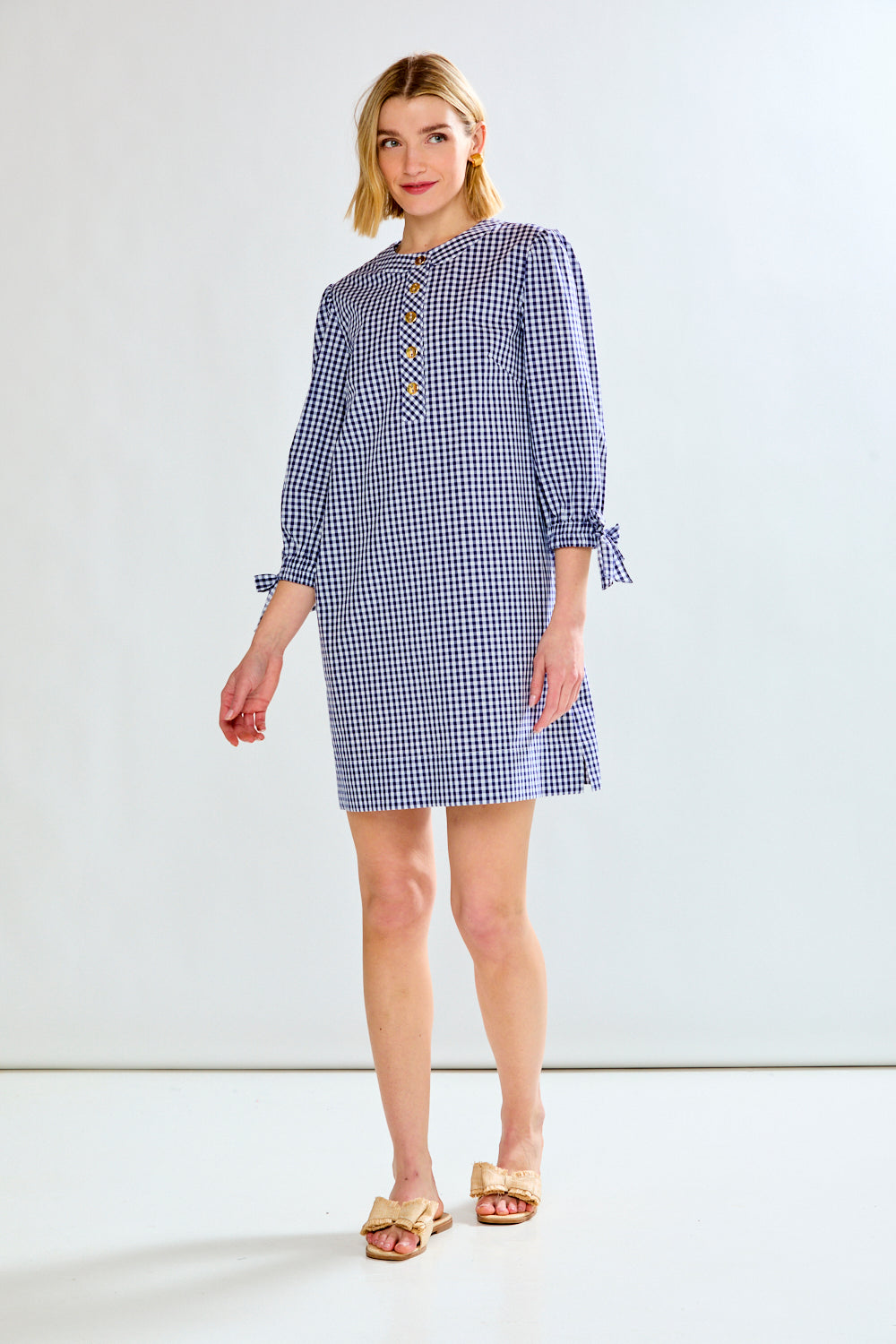 woman in plad dress with sleeves