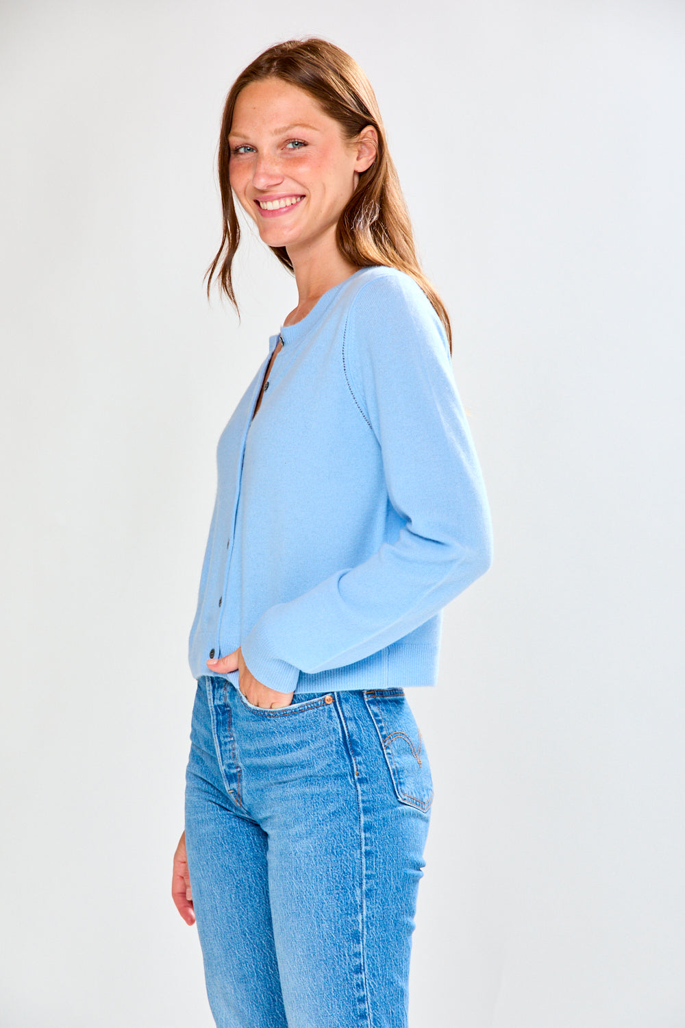 Woman in light blue cashmere sweater
