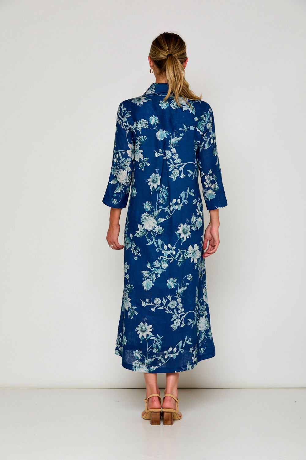 Woman in navy floral dress