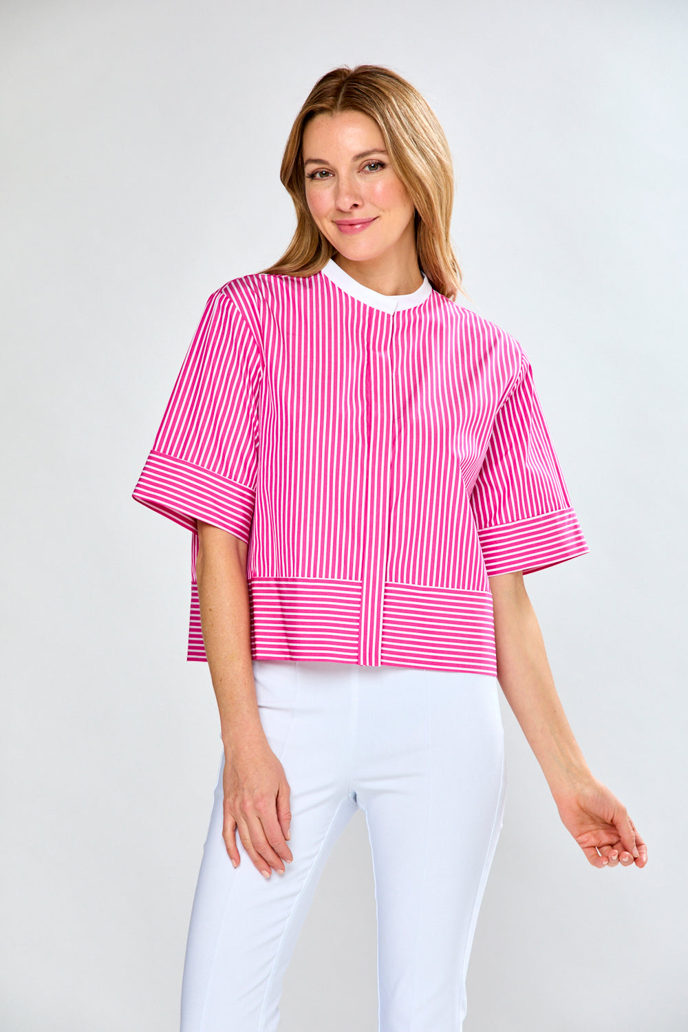 Woman in pink and white striped blouse