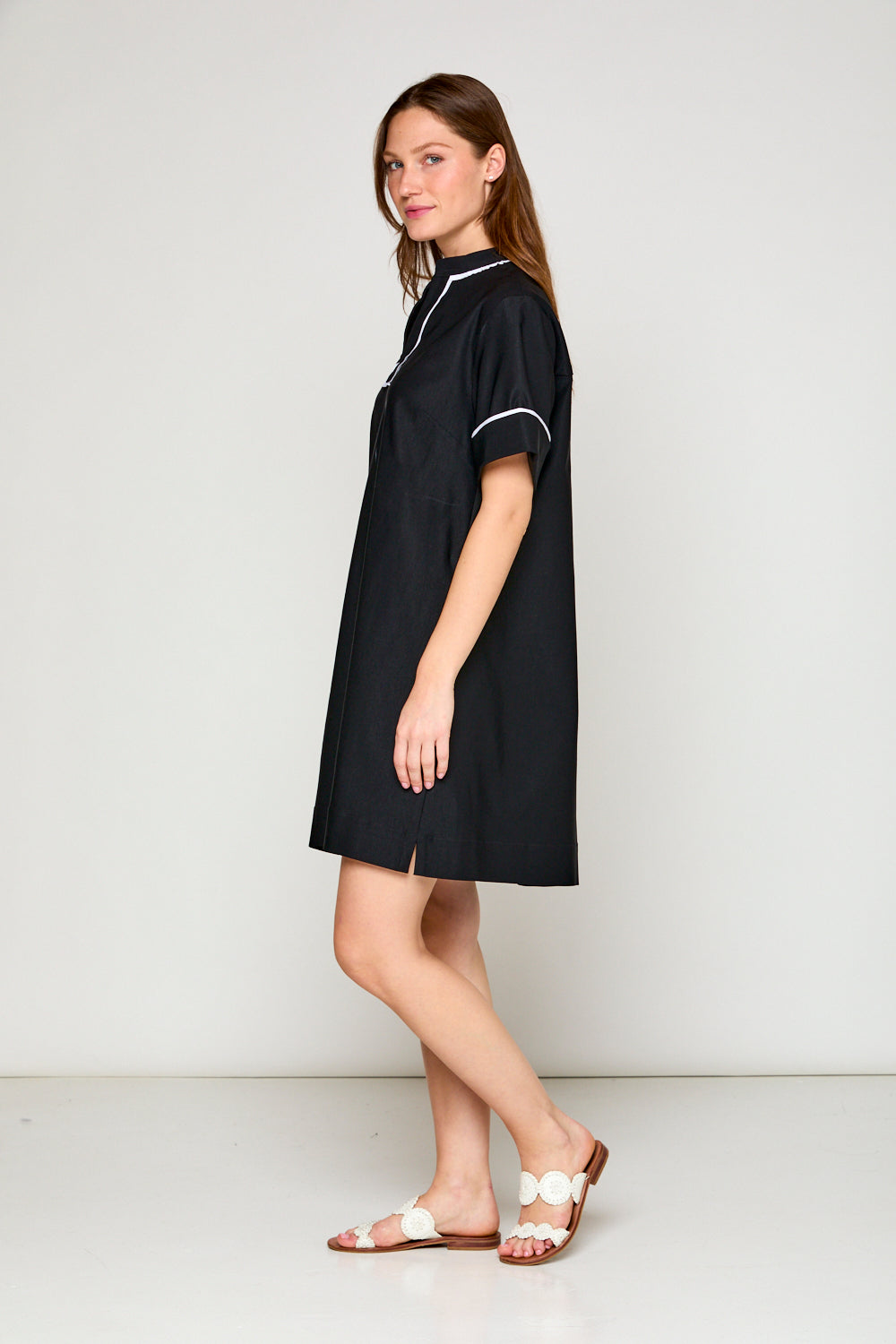 Woman in black short sleeve dress