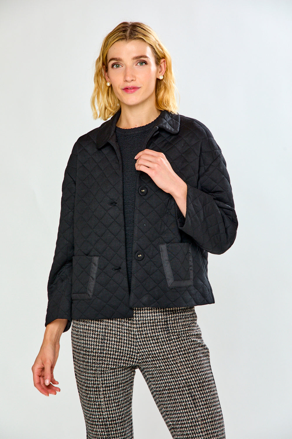 Woman in black quilt jacket