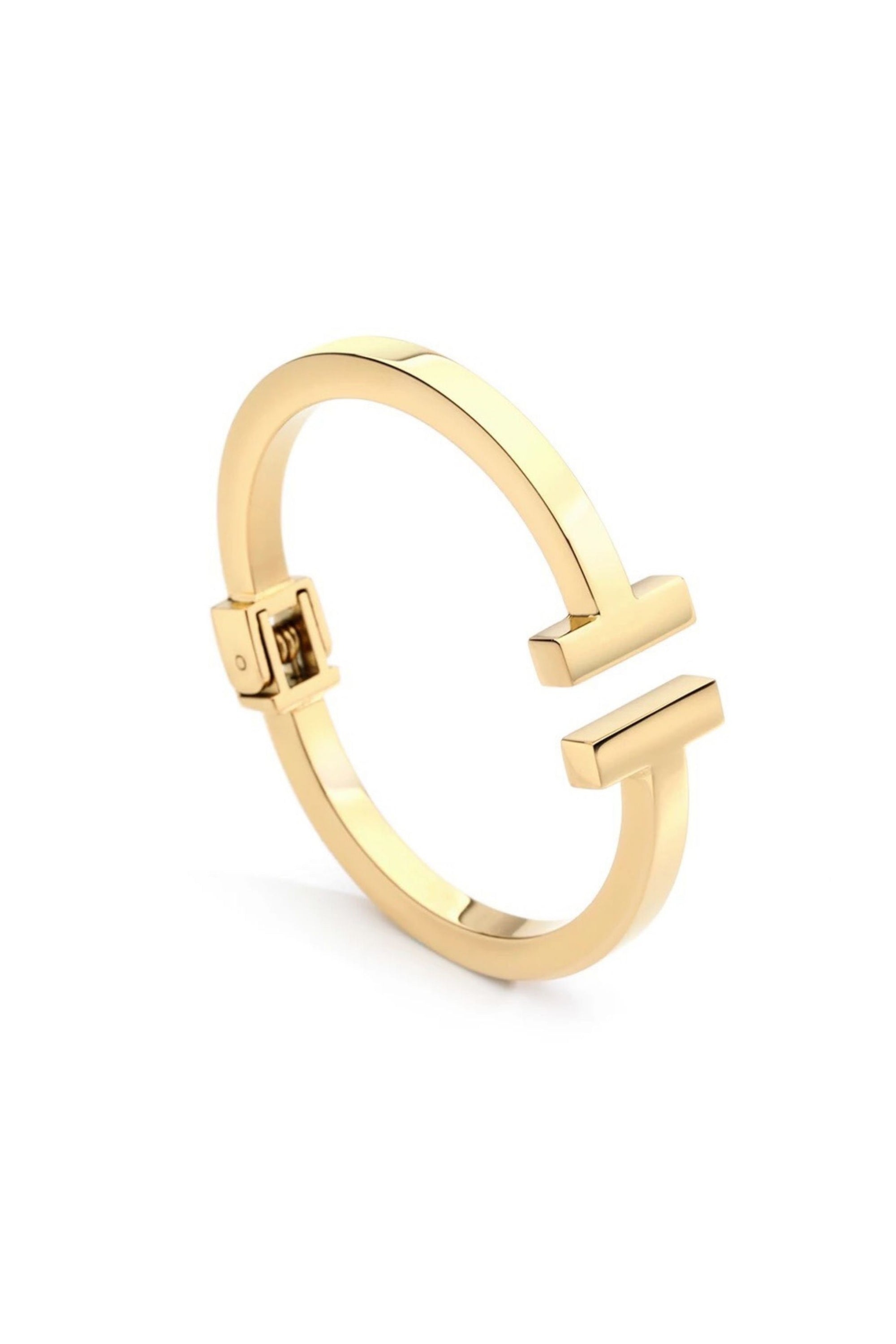 Gold ring with a unique design on a white background