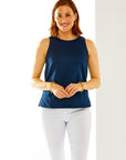 Woman in navy sleeveless top