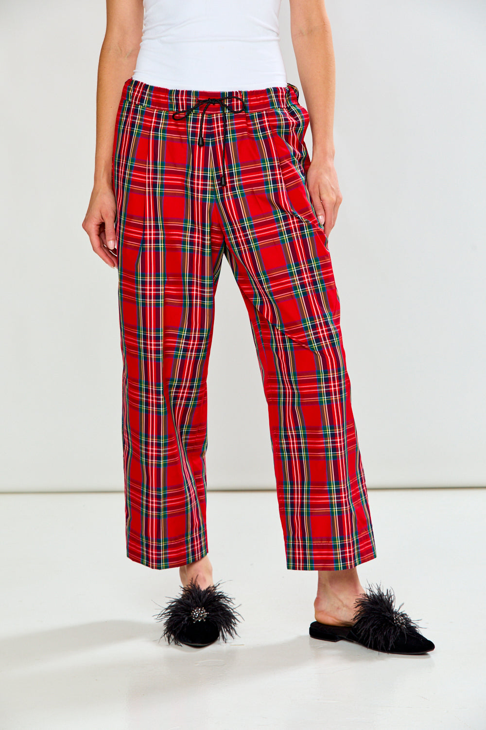 The Marcia Pant - Red Plaid shown as women's red plaid pants with a drawstring waist and wide legs in a chic classic style