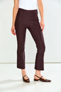 A model wearing dark brown cropped trousers, a white top, and dark brown flat shoes, shown from the waist down against a plain white studio background.