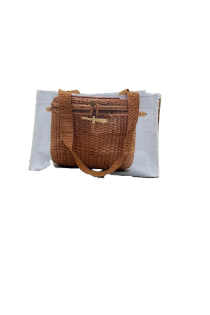 Wicker handbag with a textured white bag on a white background