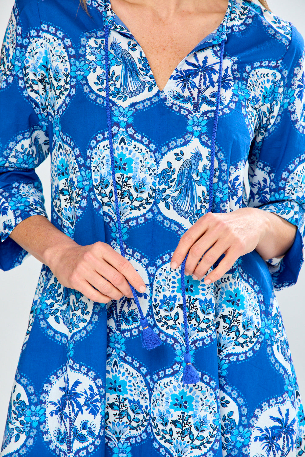 Woman in blue french tile caftan