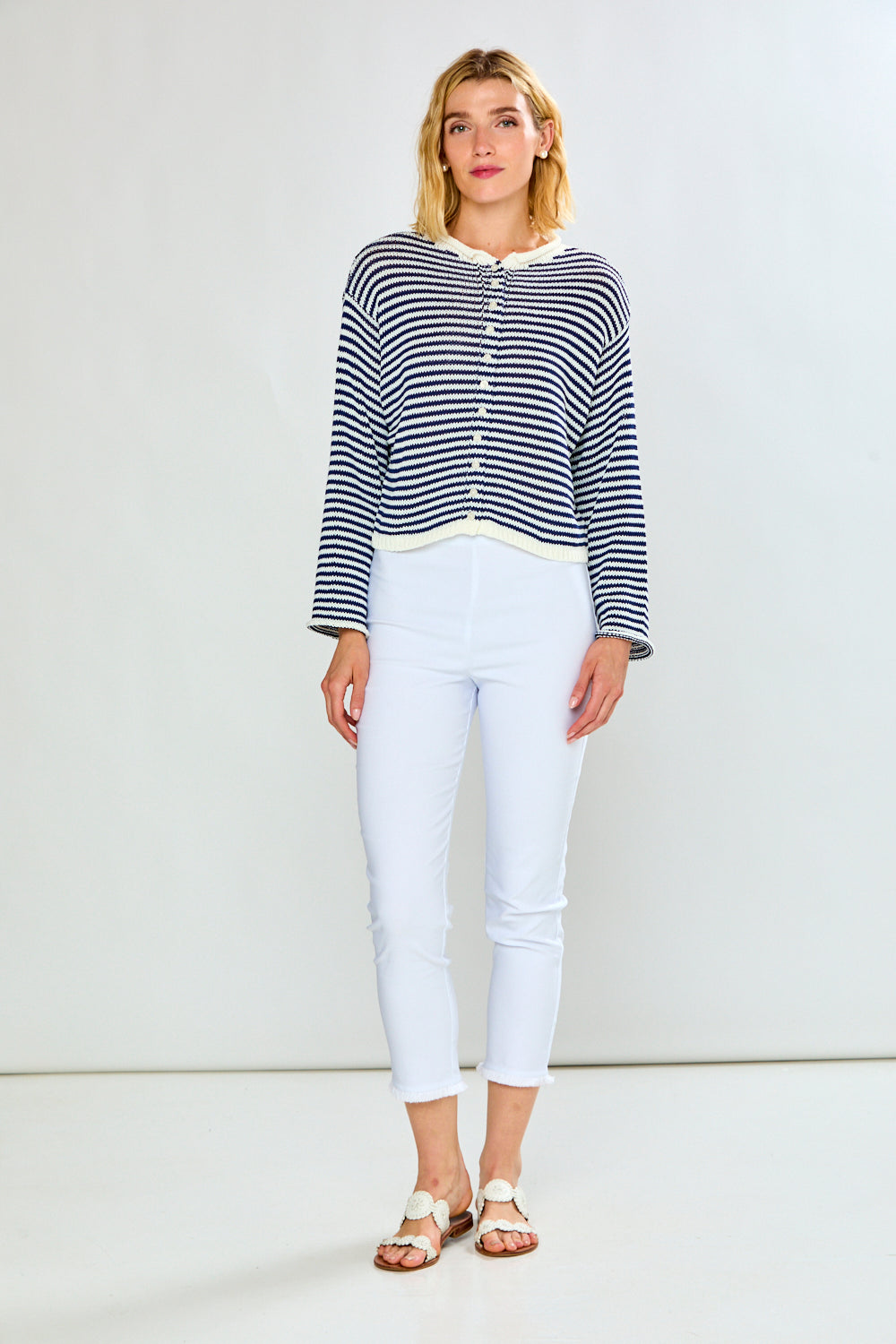 Woman in navy and white striped cardigan