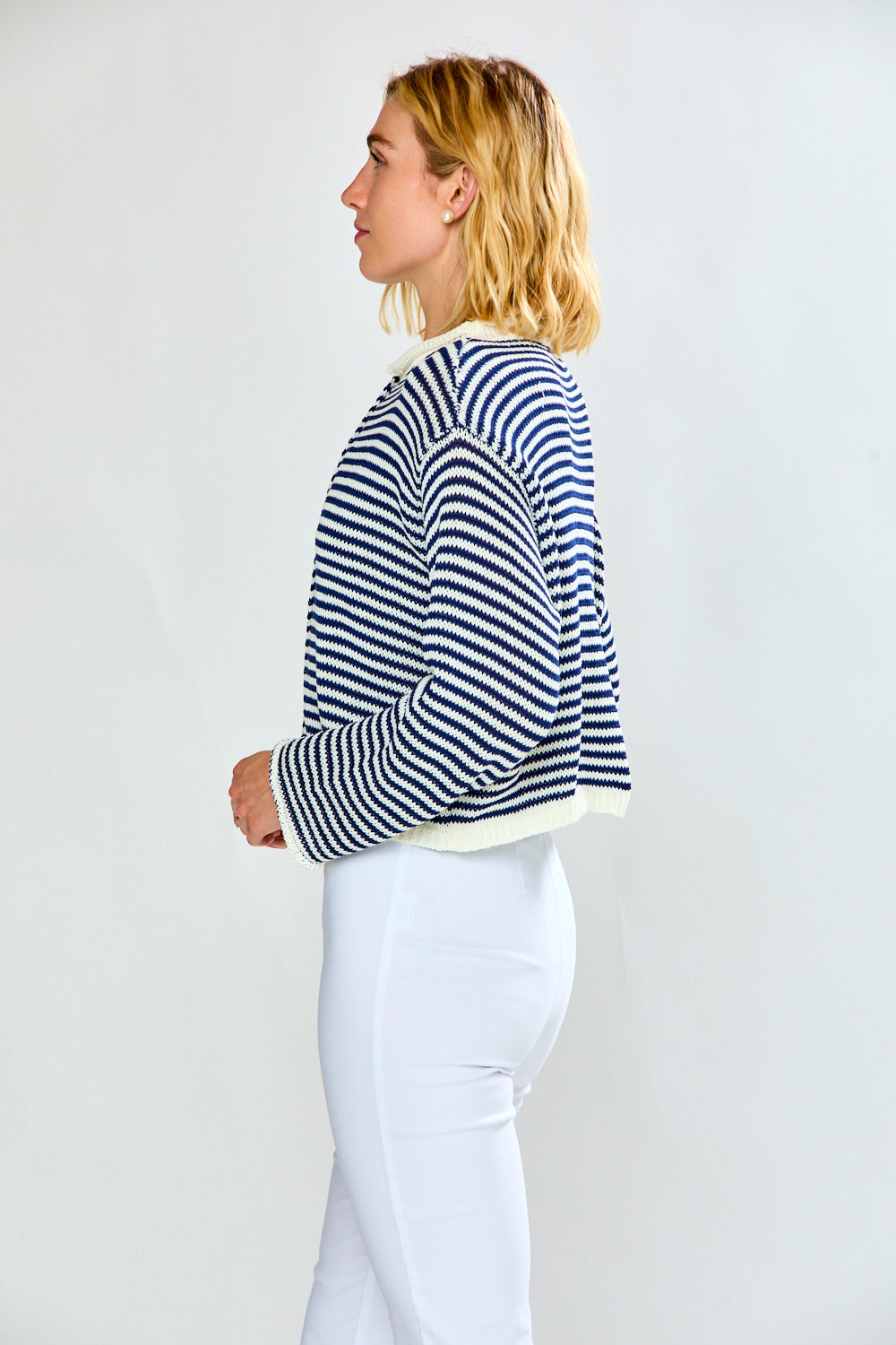 Woman in navy and white striped cardigan
