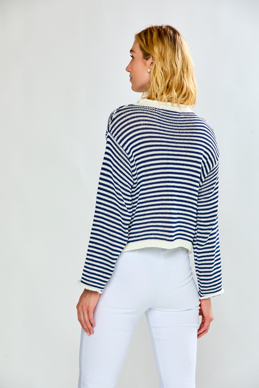 Woman in navy and white striped cardigan