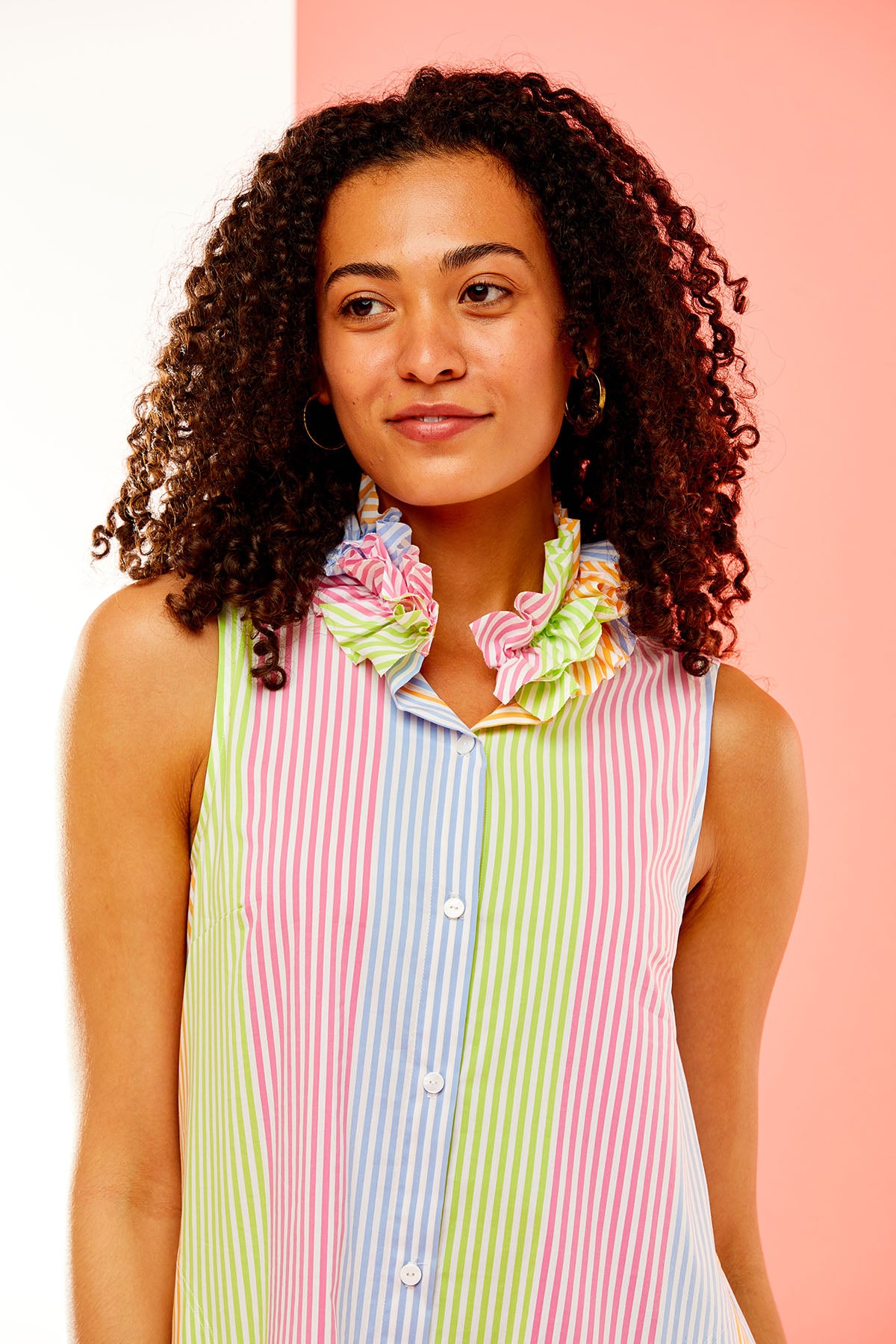 Woman in multi-colored stripe dress