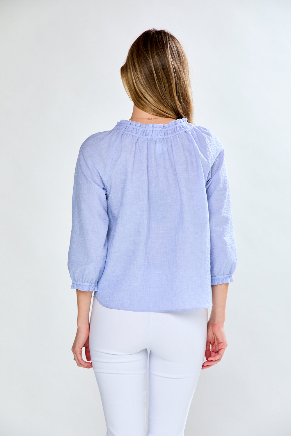 Woman in seersucker blouse
