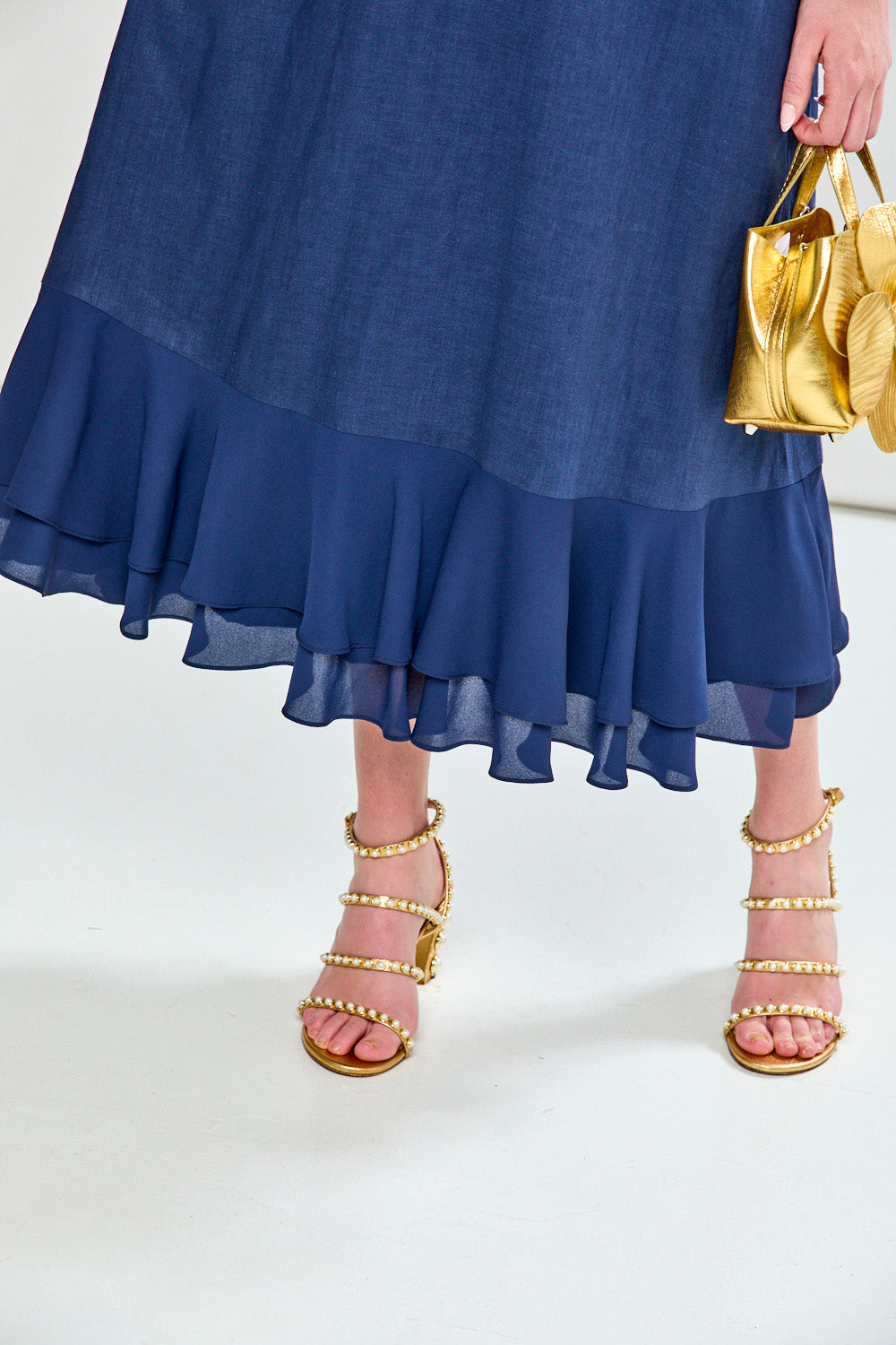 Woman in navy tea length dress