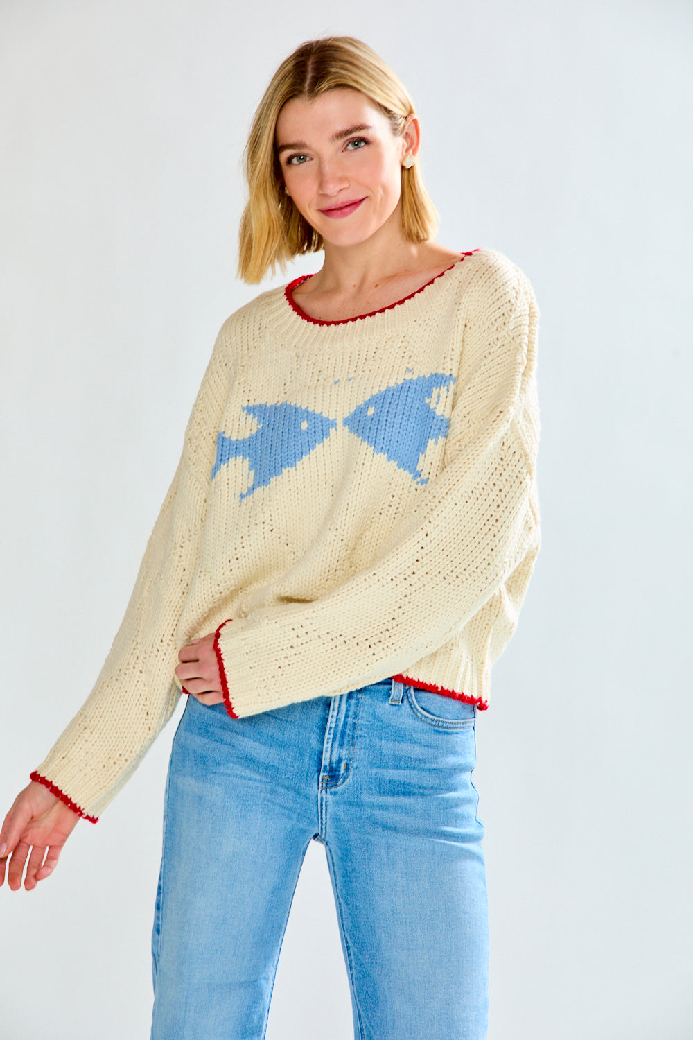 Woman with cream fish sweater on