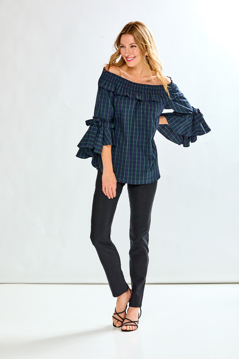 Woman in plaid on/off shoulder top